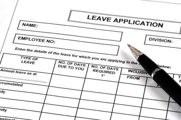 A pen on a leave application document
