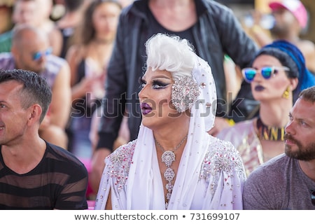 Amsterdam, The Netherlands - July 30 2017: admirative audience with a drag  queen at