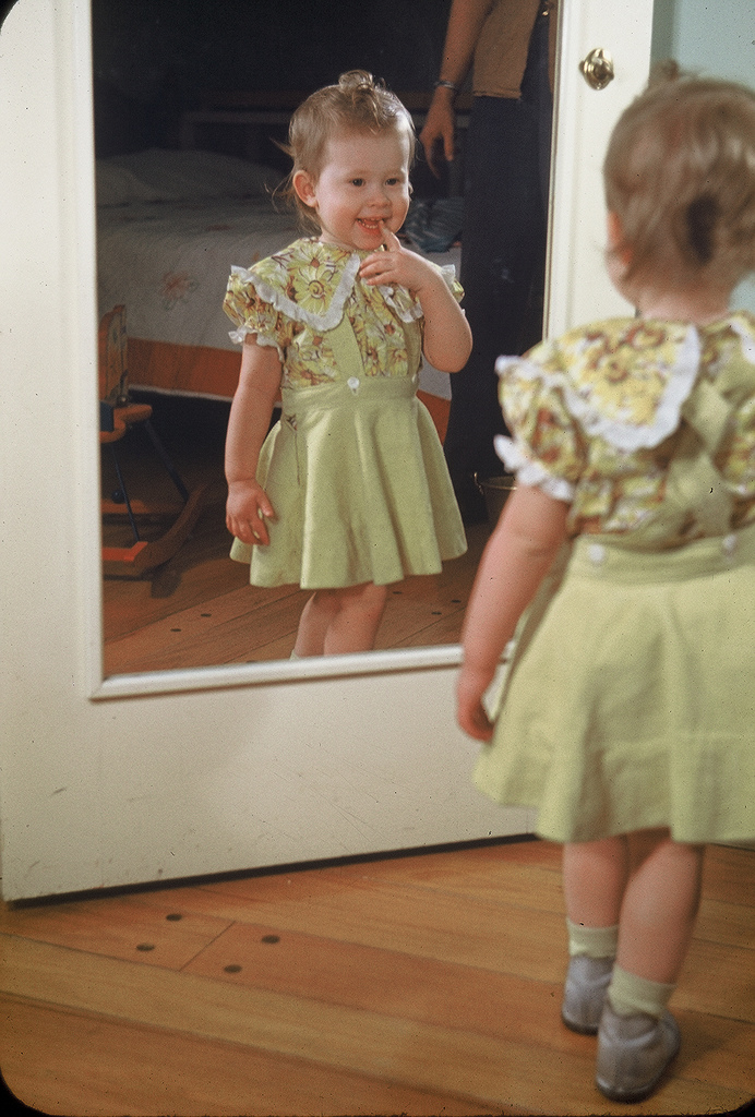 The TV star admires herself in the mirror, 1948