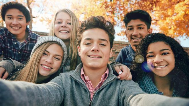 Group of adolescents posing for a selfie
