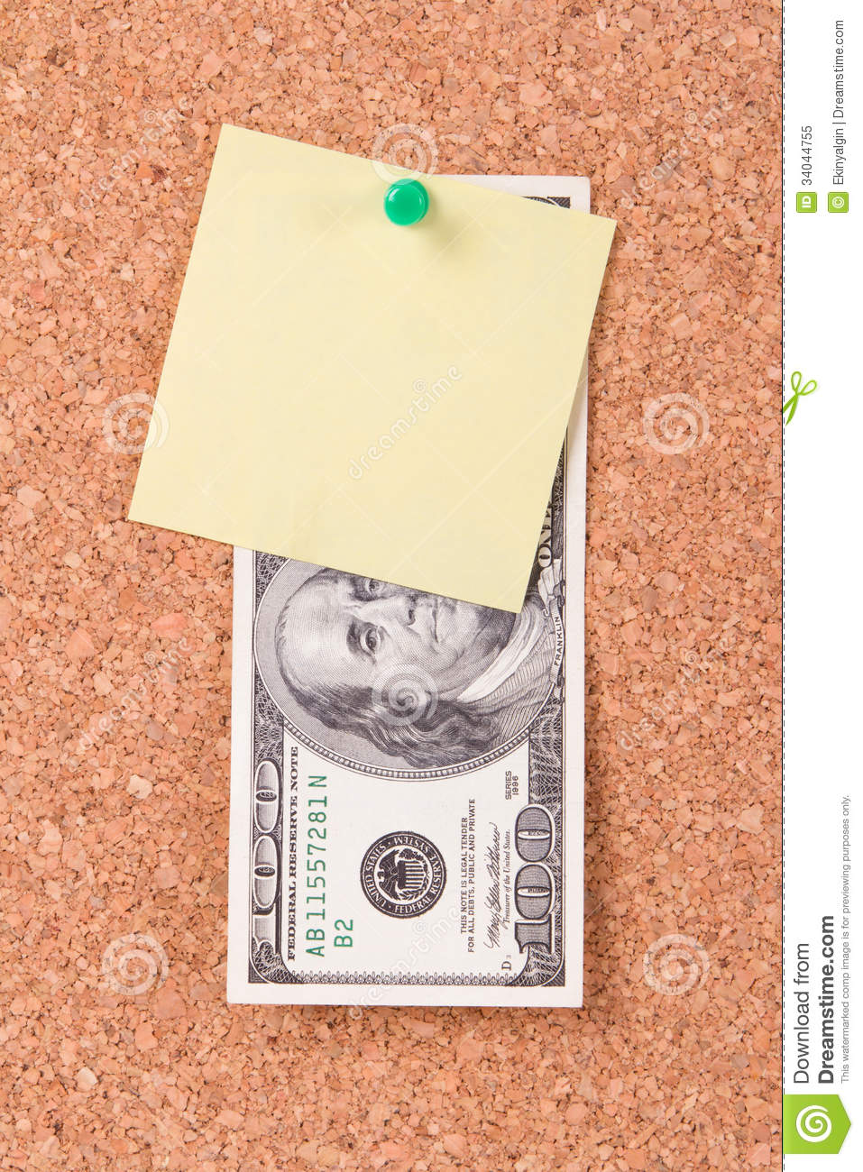 One hundred dollar bill and blank, empty yellow sticky post affixed to cork  board with green pin.