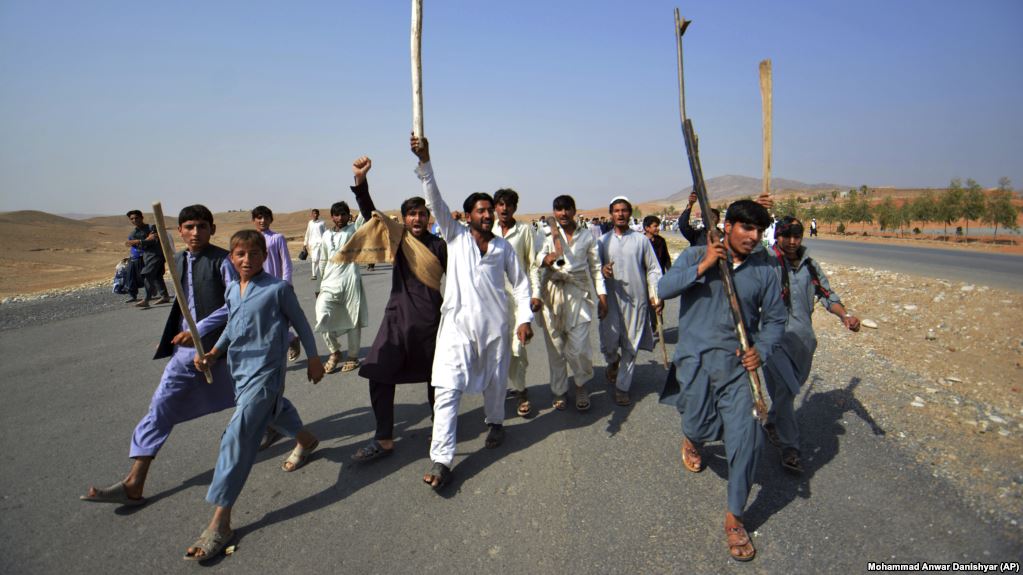Afghans shout slogans against the government after a military operation  reportedly left many civilians dead in