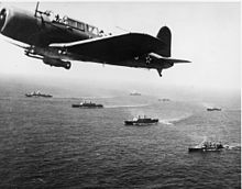 A SB2U Vindicator scout bomber from USS Ranger flies anti-submarine patrol  over Convoy WS-12, en route to Cape Town, November 27, 1941. The convoy was  one