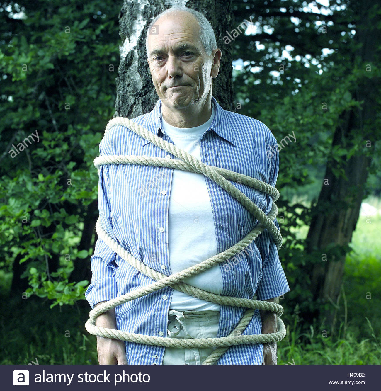 Garden, trunk, senior, tied up, half portrait, man, tree, bound,  fastenedly, rope, cable, cord, helplessness, helplessly, defenceless,  caught, trapped,