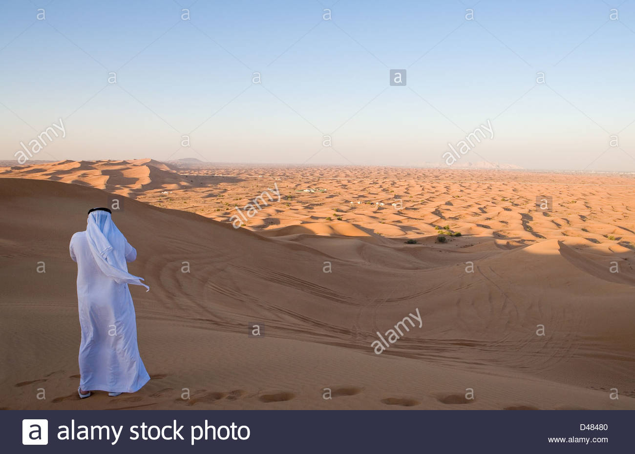 Dubai, a man in traditional dress in the Al Dhana desertic area