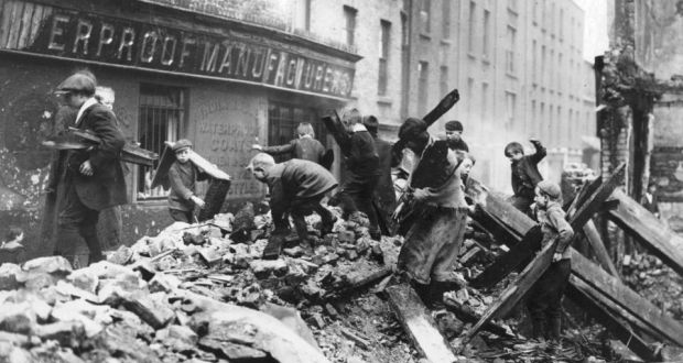 Children scavenge in rubble during the 1916 Rising. More than half of  casualties were civilian