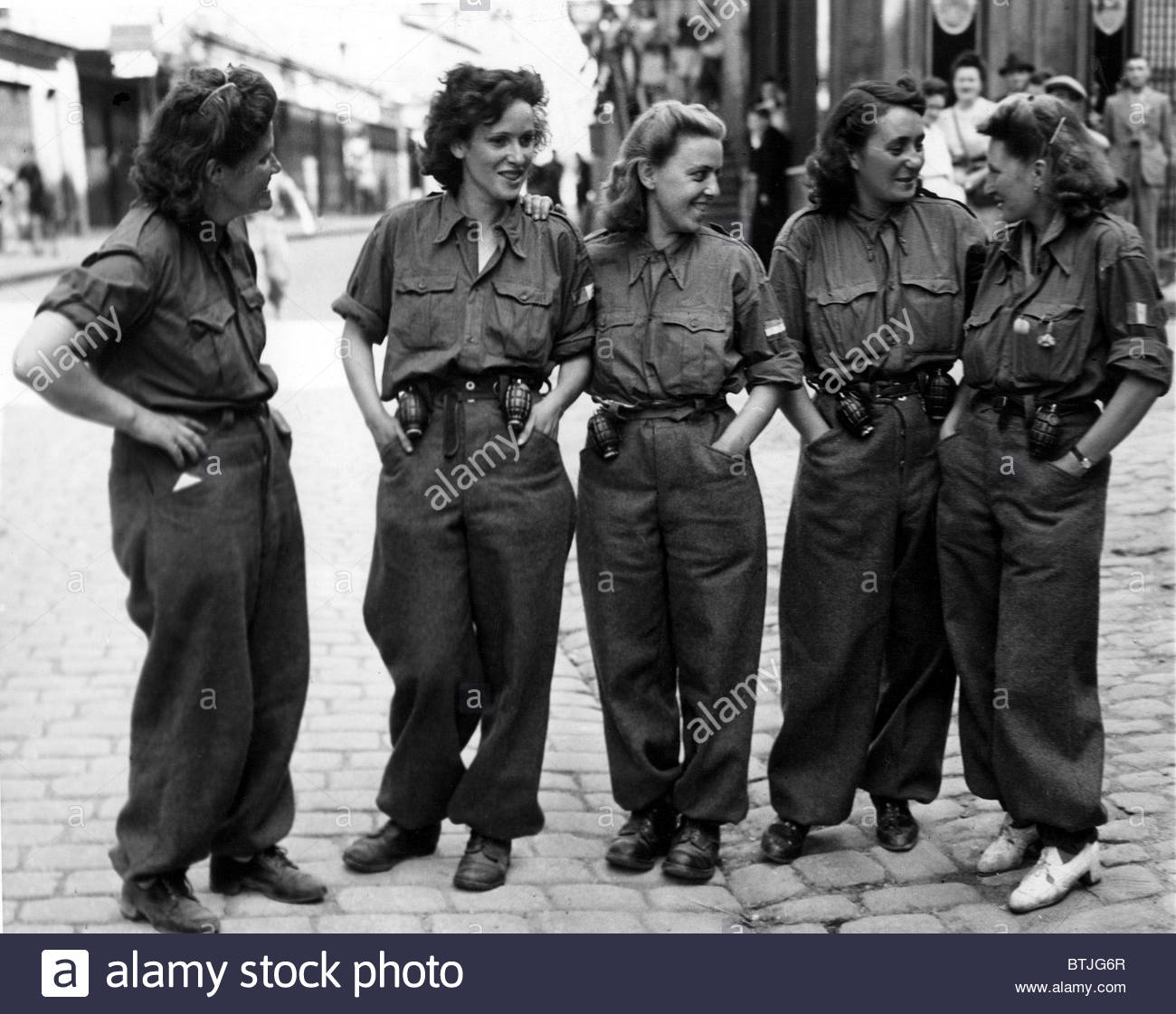 FRANCE-- These women are members of the FFI (French Forces of the  Interior), acting as guides, scouts, and assisting in mopping