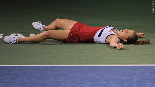 Anna Chakvetadze lies prostrate on the court after fainting during her  match against Caroline Wozniacki.