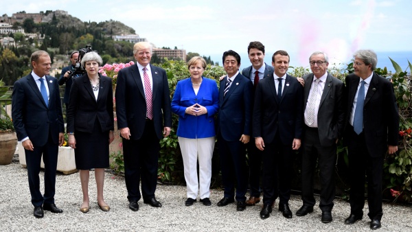 U.S. President Donald J. Trump meets with the other G7 leaders, including  EU participants, during a May 2017 summit in Taormina, Sicily.