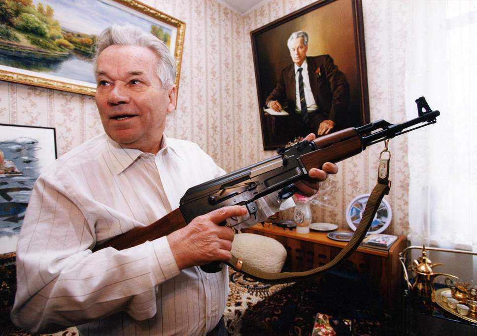 MIKHAIL KALASHNIKOV WITH AN AK-47 RIFLE